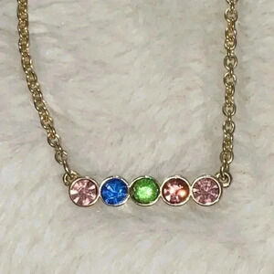 Gold tone necklace with pink, green and blue rhinestones
